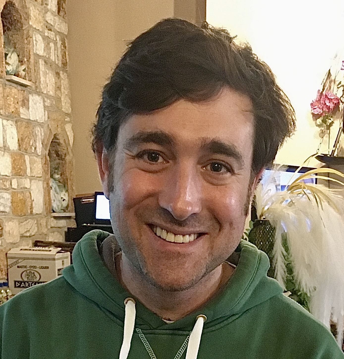 Greek man smiling in a traditional taverna