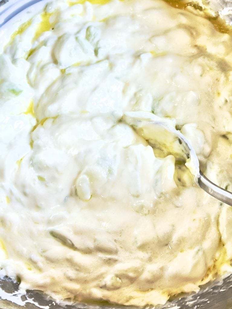 Mixing ingredients for tzatziki
