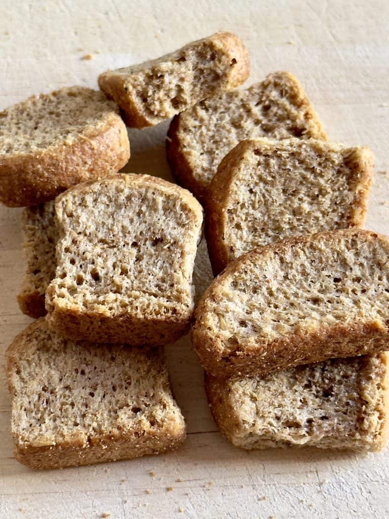 Whole wheat rusks on a wooden cutting board