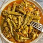 A plate of Greek okra stew in a tomato sauce served on a plate