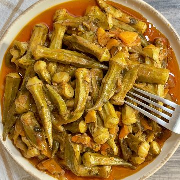A plate of Greek okra stew in a tomato sauce served on a plate