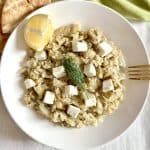 Instant Pot Greek Cabbage Rice Lahanorizo on a dish with lemon and feta and pita