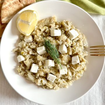 Instant Pot Greek Cabbage Rice Lahanorizo on a dish with lemon and feta and pita
