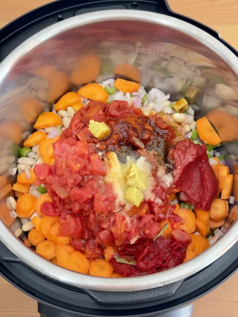 Prepared ingredients inside for fasolada inside the Instant Pot
